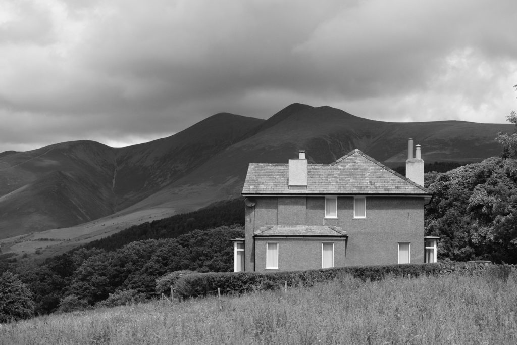 A house nearly as austere as Skiddaw behind it